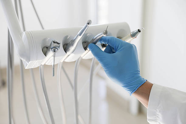 Professional Tooth Extraction technician working in Crownsville, MD